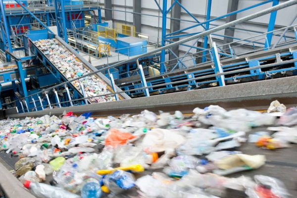 vertical-shot-of-plastic-moving-along-conveyor-bel-2026-03-26-09-13-07-utc